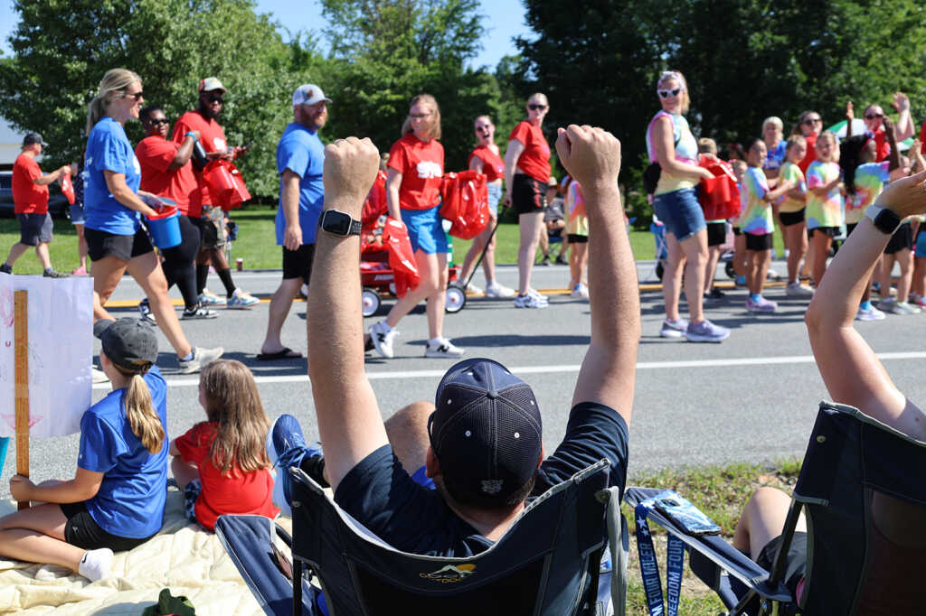 people watching a parade outside